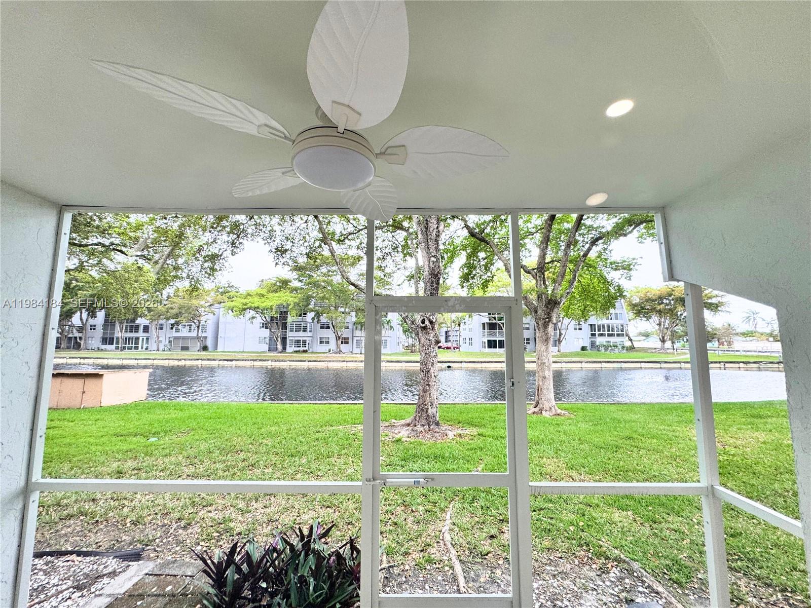 8846 West McNab Road, Unit 106 Tamarac, FL 33321 - Photo 39 of 39 a front view of a house with garden