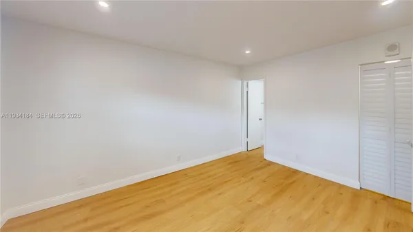 a close up of a flower pot with a window