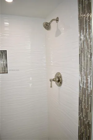 a kitchen with stainless steel appliances a stove microwave and refrigerator