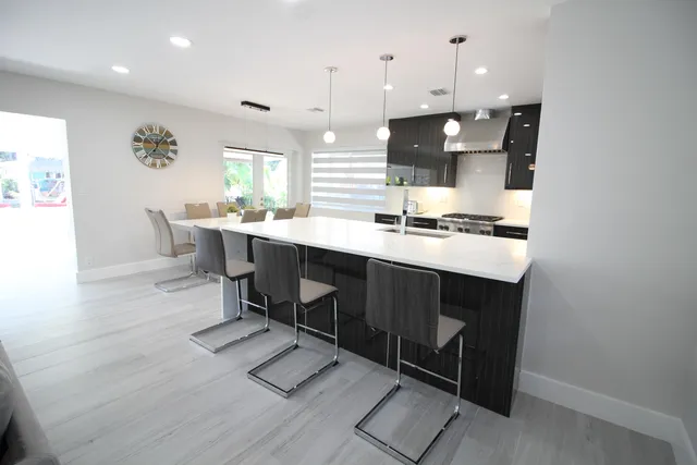 a front view of house with a garden