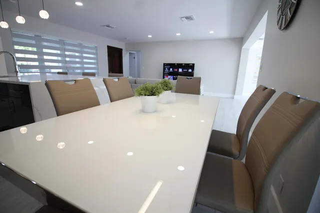 an aerial view of a house with an outdoor space