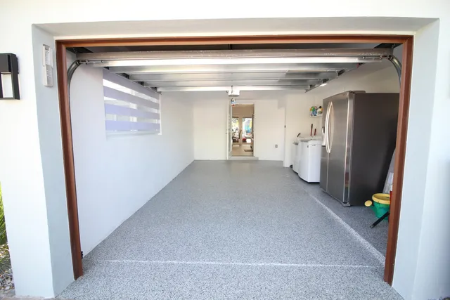 a living room with stainless steel appliances kitchen island granite countertop furniture and a kitchen view