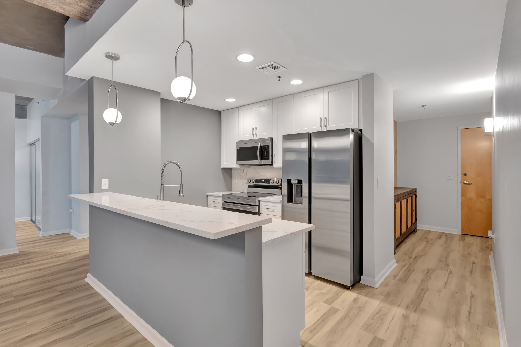 415 Church Street, Unit 1805 Nashville, TN 37219 - Photo 13 of 66 a kitchen with stainless steel appliances a refrigerator sink and stove