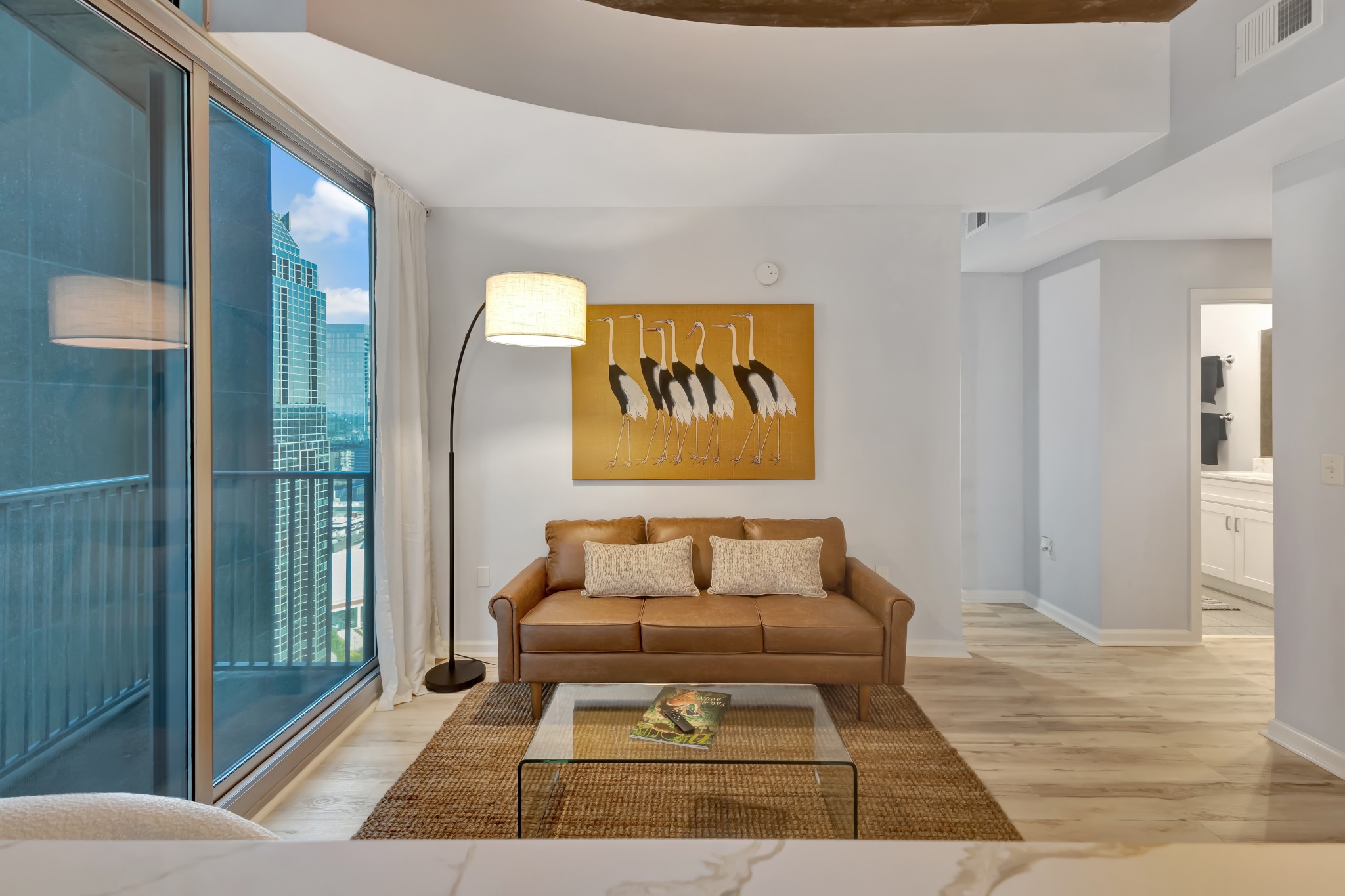 415 Church Street, Unit 1805 Nashville, TN 37219 - Photo 24 of 66 a living room with a couch and a rug