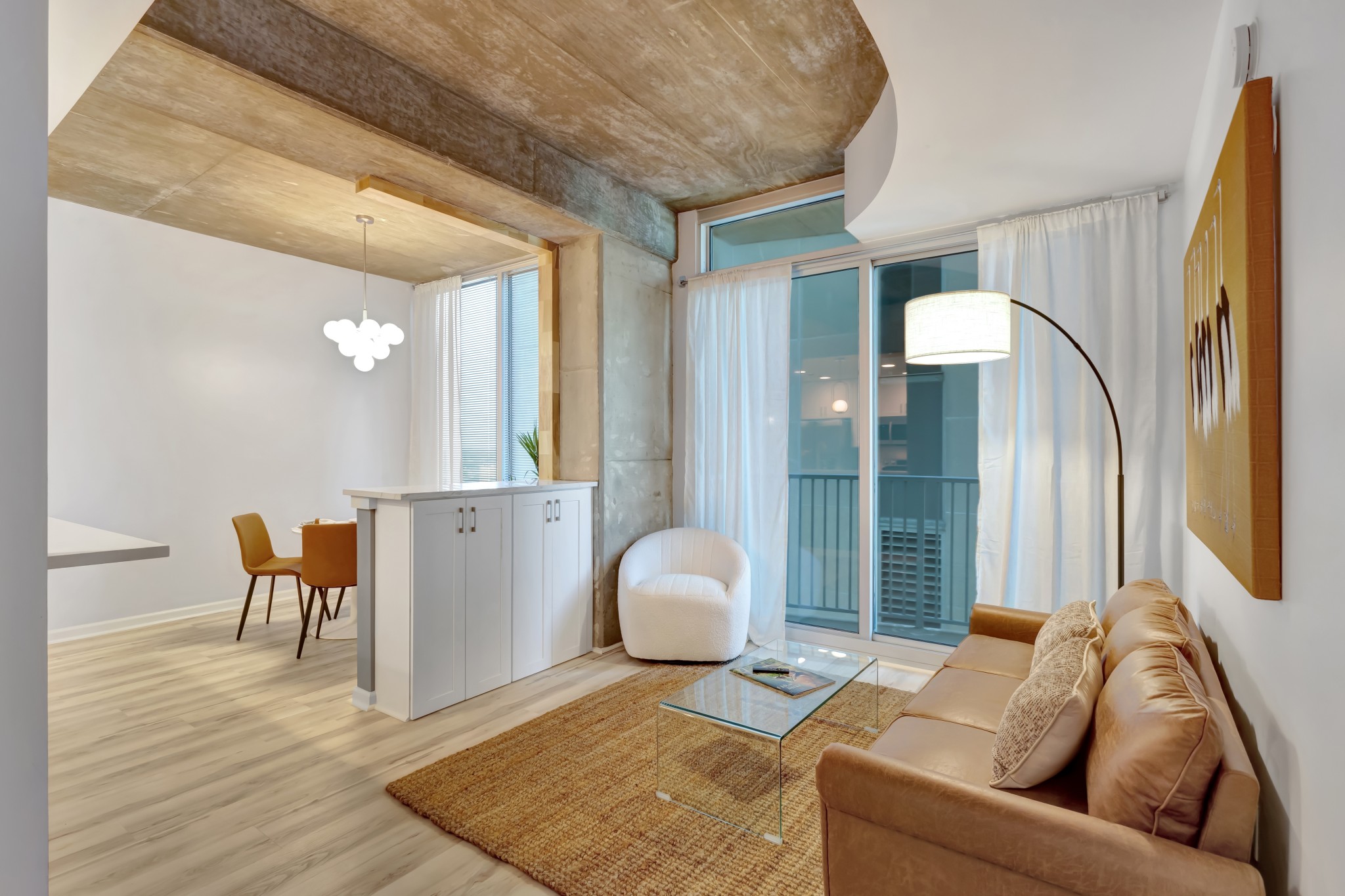 415 Church Street, Unit 1805 Nashville, TN 37219 - Photo 29 of 66 a living room with furniture and wooden floor