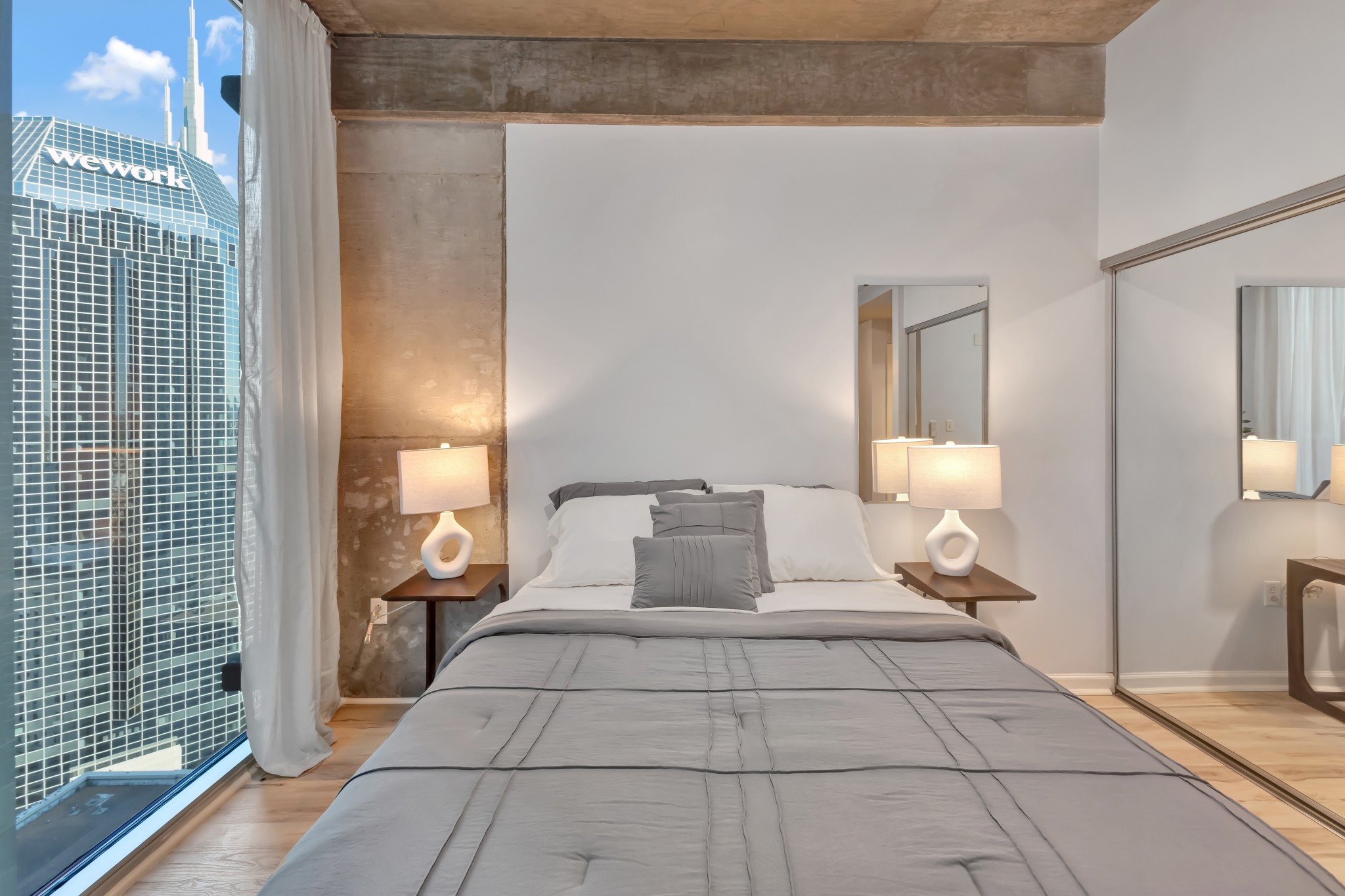 415 Church Street, Unit 1805 Nashville, TN 37219 - Photo 33 of 66 a bathroom with a toilet and a mirror