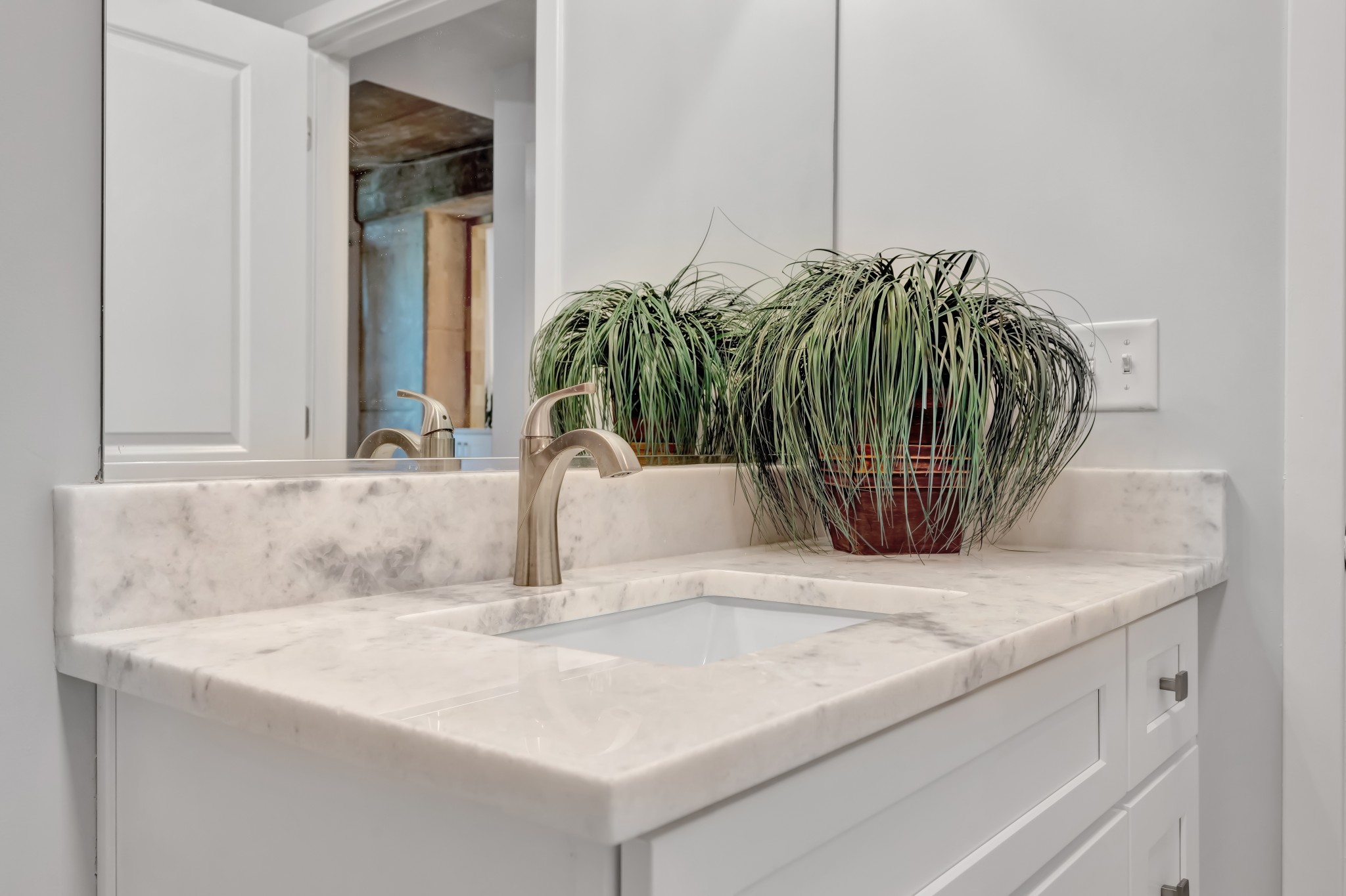 415 Church Street, Unit 1805 Nashville, TN 37219 - Photo 36 of 66 a bathroom with a sink and mirror