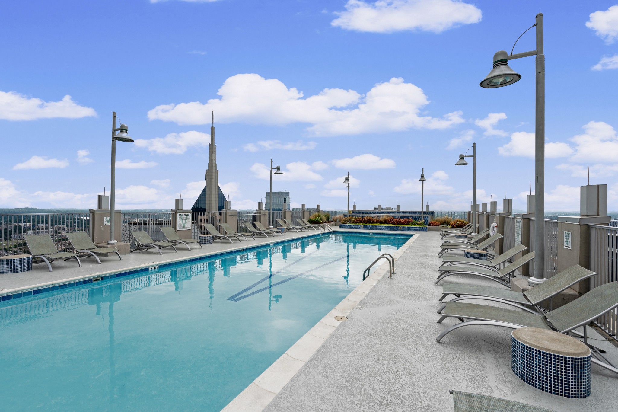 415 Church Street, Unit 1805 Nashville, TN 37219 - Photo 42 of 66 a view of a swimming pool with outdoor seating