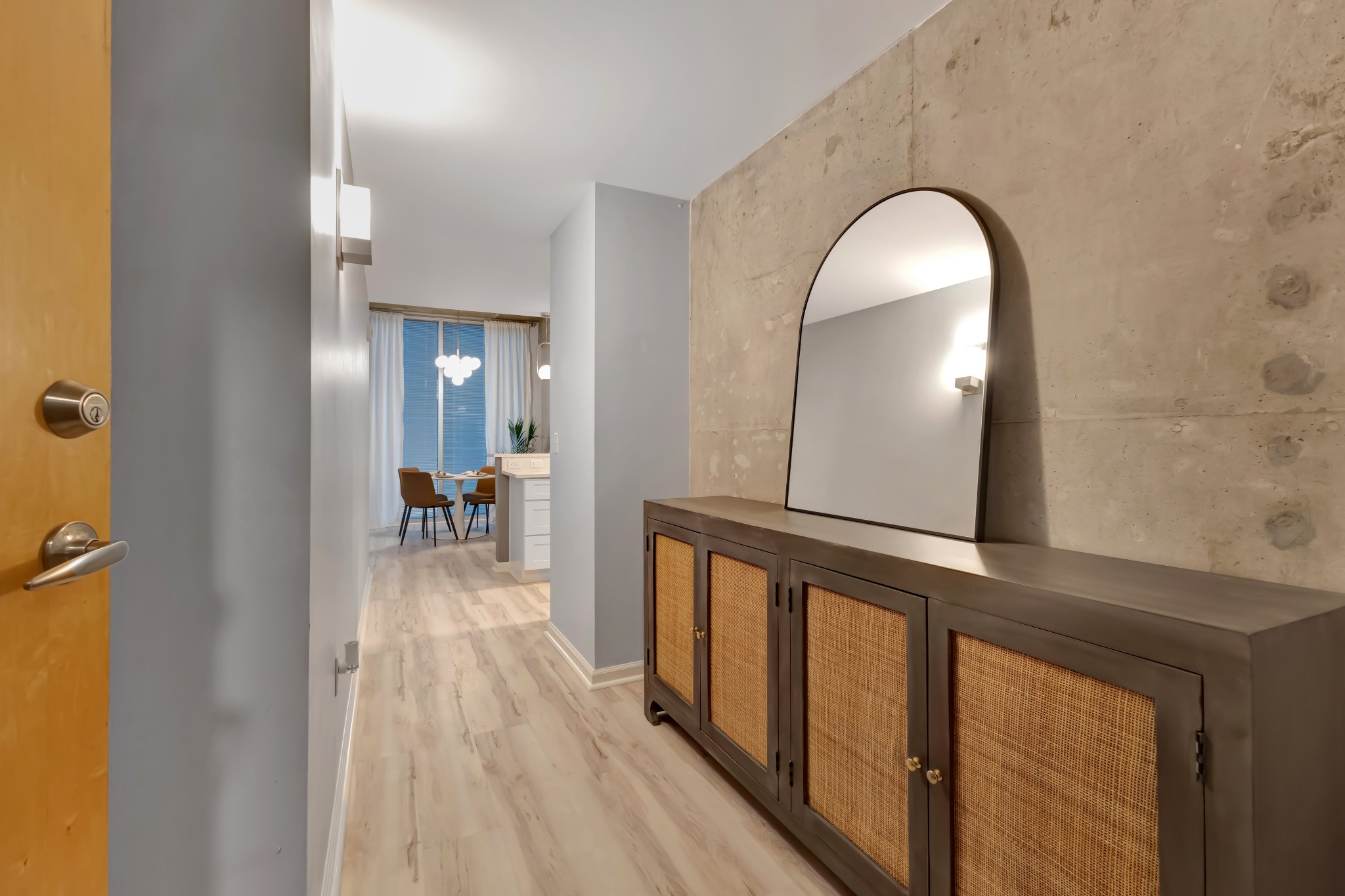 415 Church Street, Unit 1805 Nashville, TN 37219 - Photo 8 of 66 a view of a living room and bathroom with a mirror