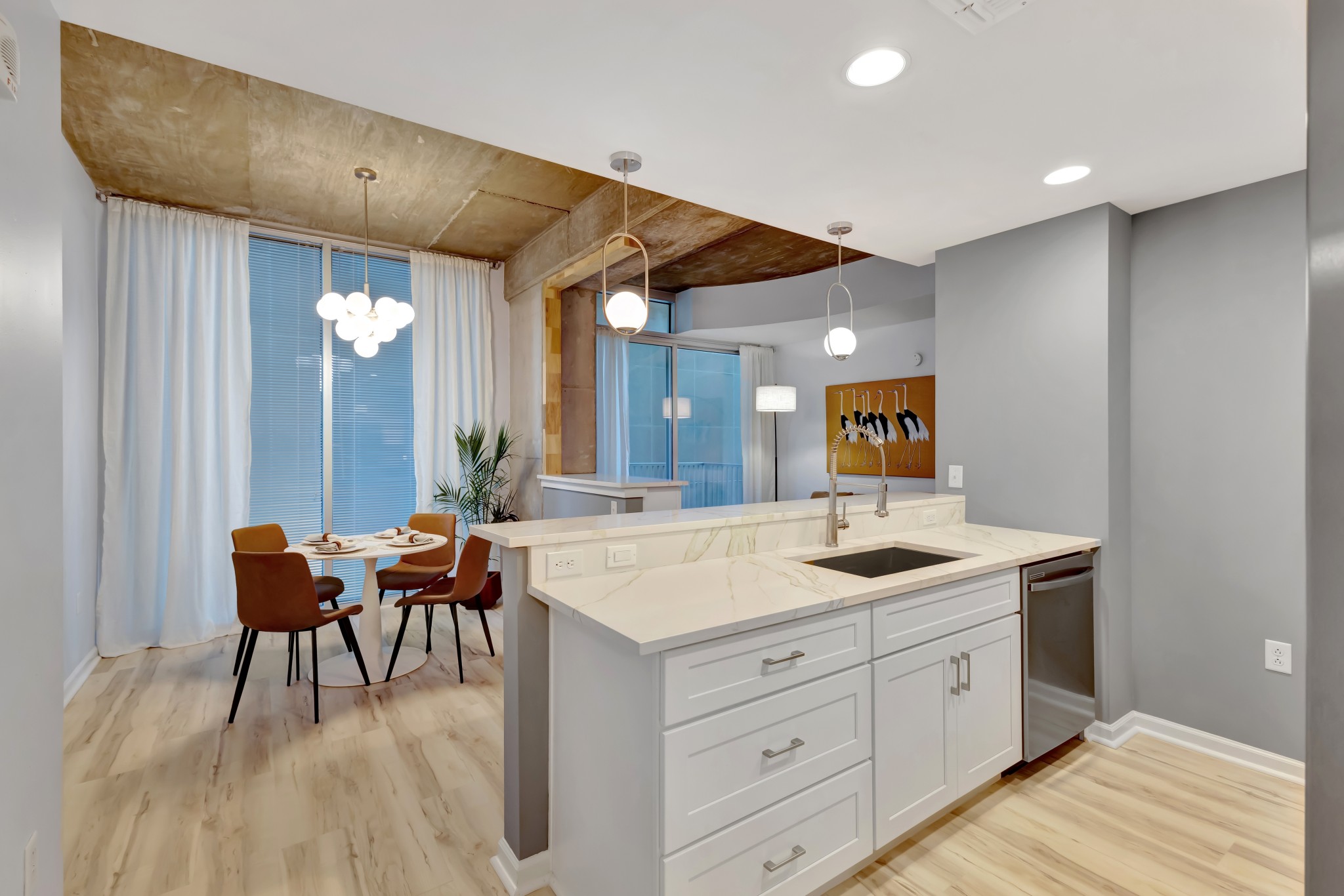 415 Church Street, Unit 1805 Nashville, TN 37219 - Photo 10 of 66 a living room with furniture and wooden floor