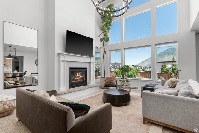 500 North 516th Street West, Unit 19 Mapleton, UT 84664 - Photo 2 of 41 Open-concept great room with soaring windows, fireplace, and abundant natural light.