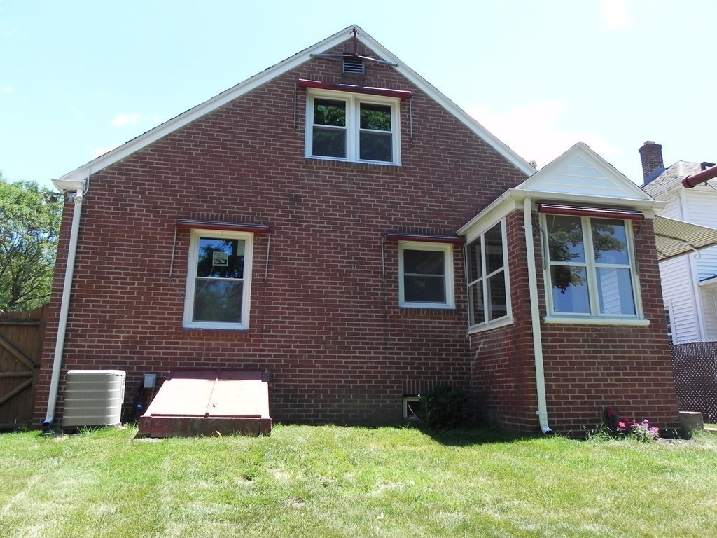206 Parker Street Springfield, MA 01151 - Photo 20 of 21 a front view of a house with a yard