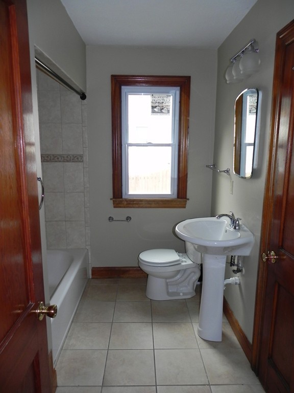 206 Parker Street Springfield, MA 01151 - Photo 8 of 21 a bathroom with a sink toilet and shower
