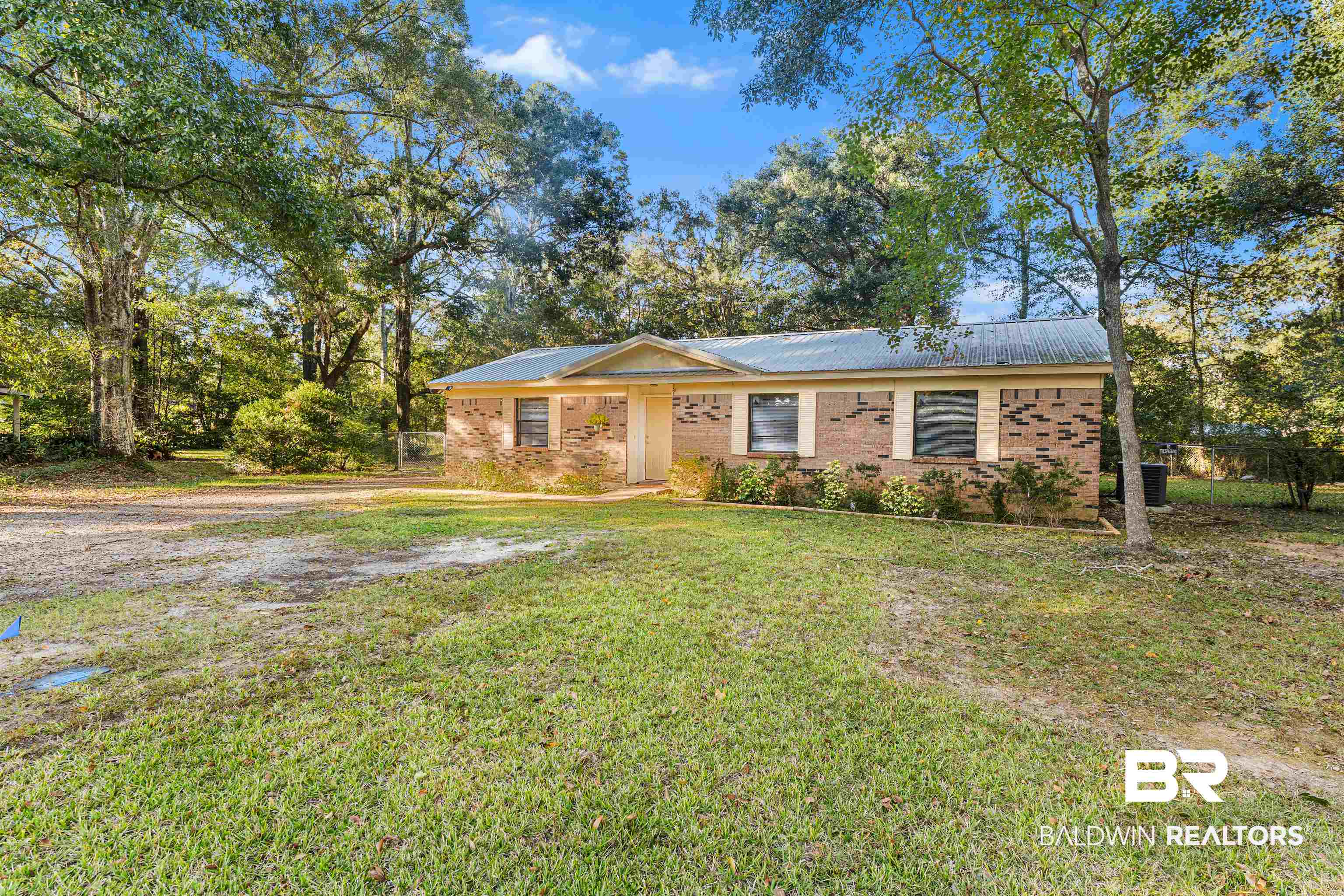 5551 Springer Court Theodore, AL 36582 - Photo 9 of 37 Single story home with brick siding and a front yard
