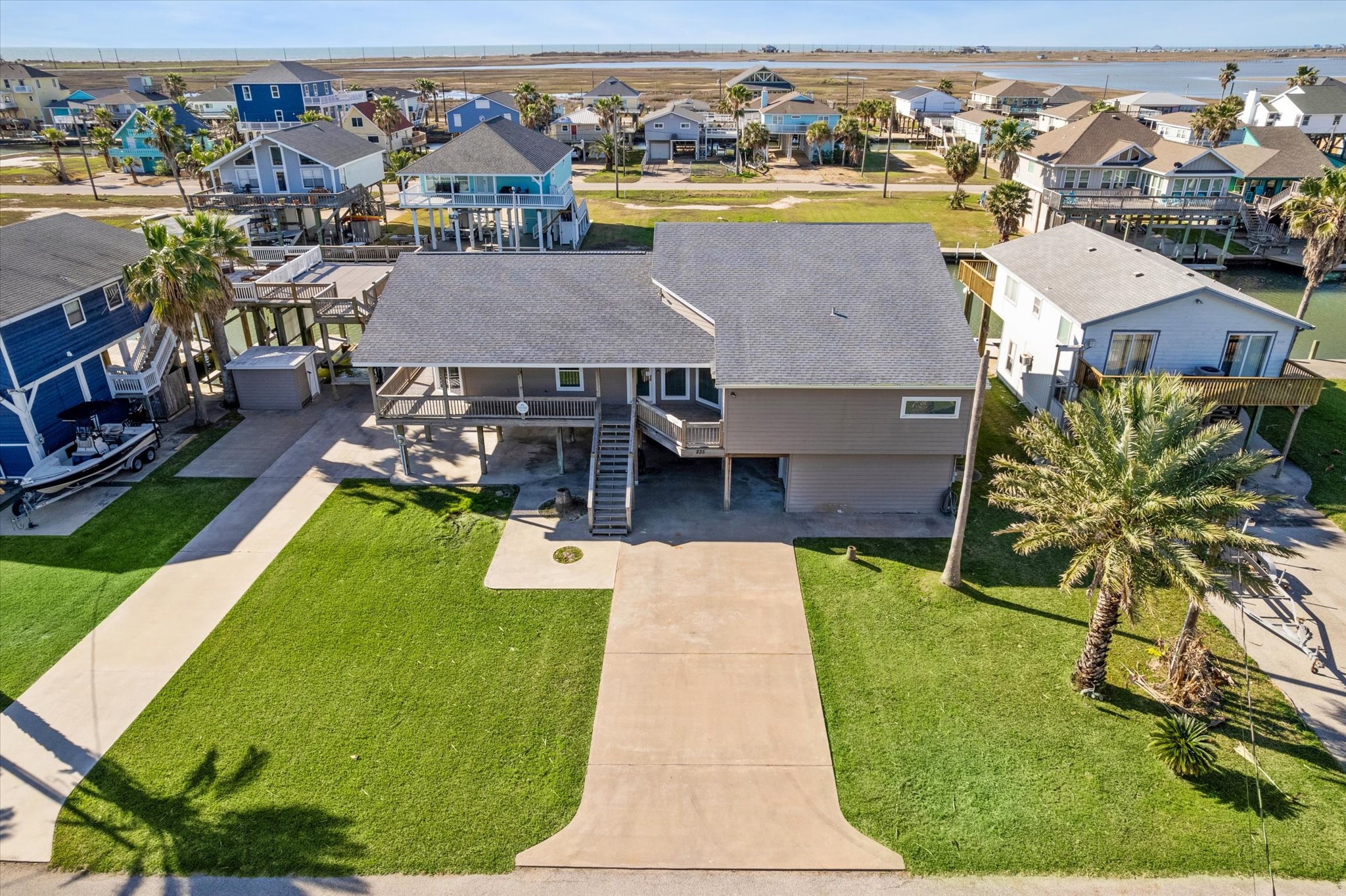 235 Galleon Freeport, TX 77541 - Photo 2 of 45 an aerial view of a house with swimming pool lawn chairs and a yard