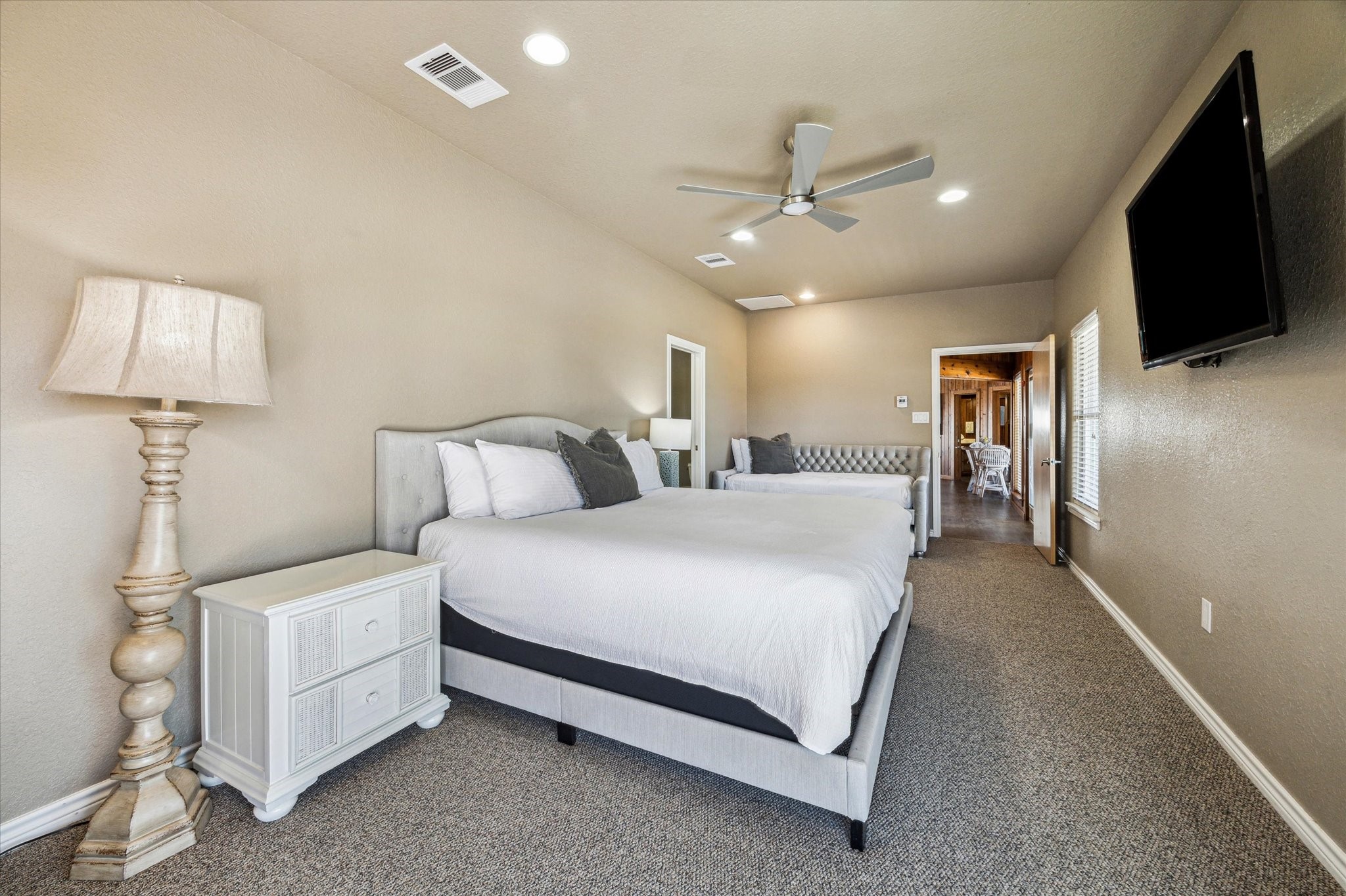 235 Galleon Freeport, TX 77541 - Photo 21 of 45 a spacious bedroom with a bed and a flat screen tv
