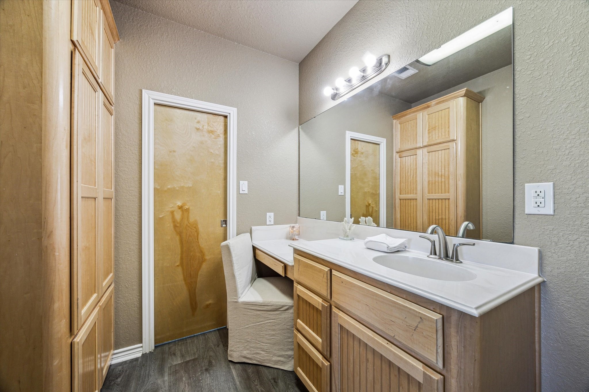 235 Galleon Freeport, TX 77541 - Photo 23 of 45 a bathroom with a sink and a mirror