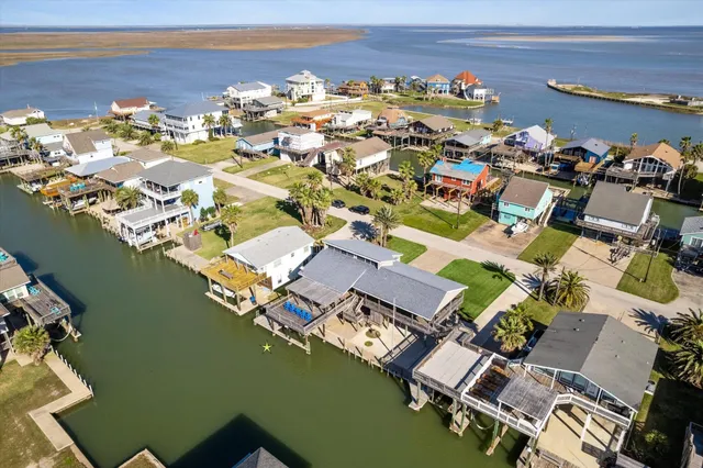 an aerial view of a house with a ocean view