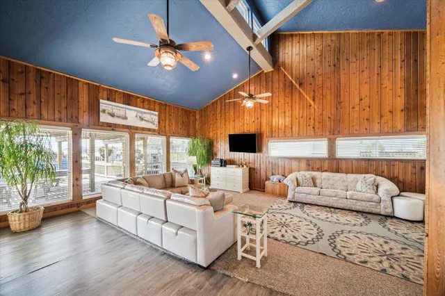 a living room with furniture fireplace and a flat screen tv