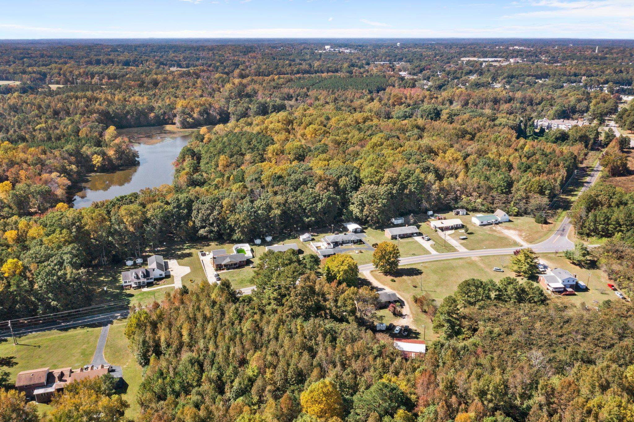 22 Ennis Murphy Road Henderson, NC 27537 - Photo 3 of 19 an aerial view of residential houses with outdoor space
