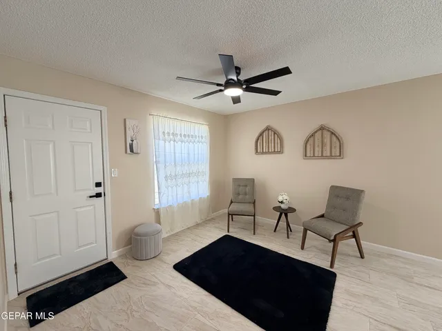 a living room with furniture and a window