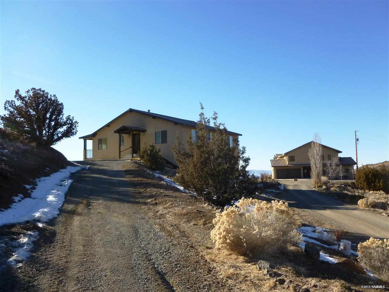 6755 Quaking Aspen Road Reno, NV 89510 - Photo 1 of 1 a front view of a house with a yard