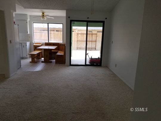 309 Petris Avenue Ridgecrest, CA 93555 - Photo 5 of 19 a view of room with furniture and a window