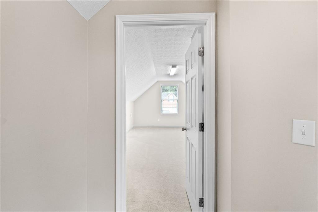 241 Red Bud Road Jefferson, GA 30549 - Photo 37 of 43 a view of a bathroom from a hallway