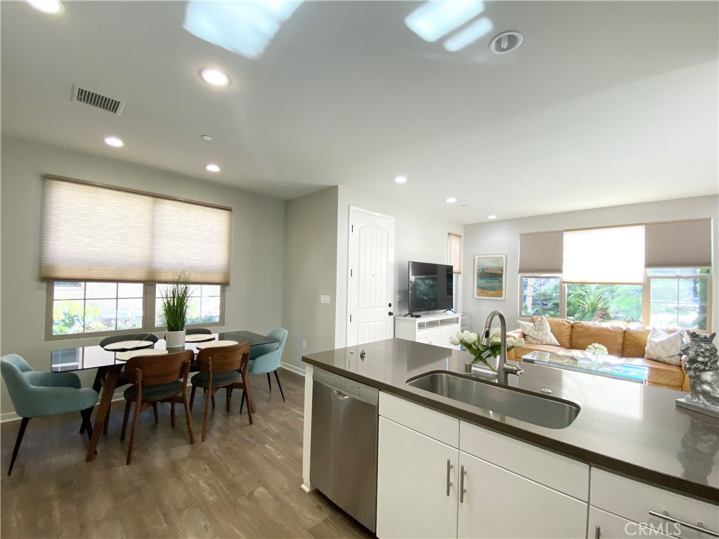 57 Bronze Leaf Irvine, CA 92620 - Photo 11 of 35 a kitchen with sink stove and dining table