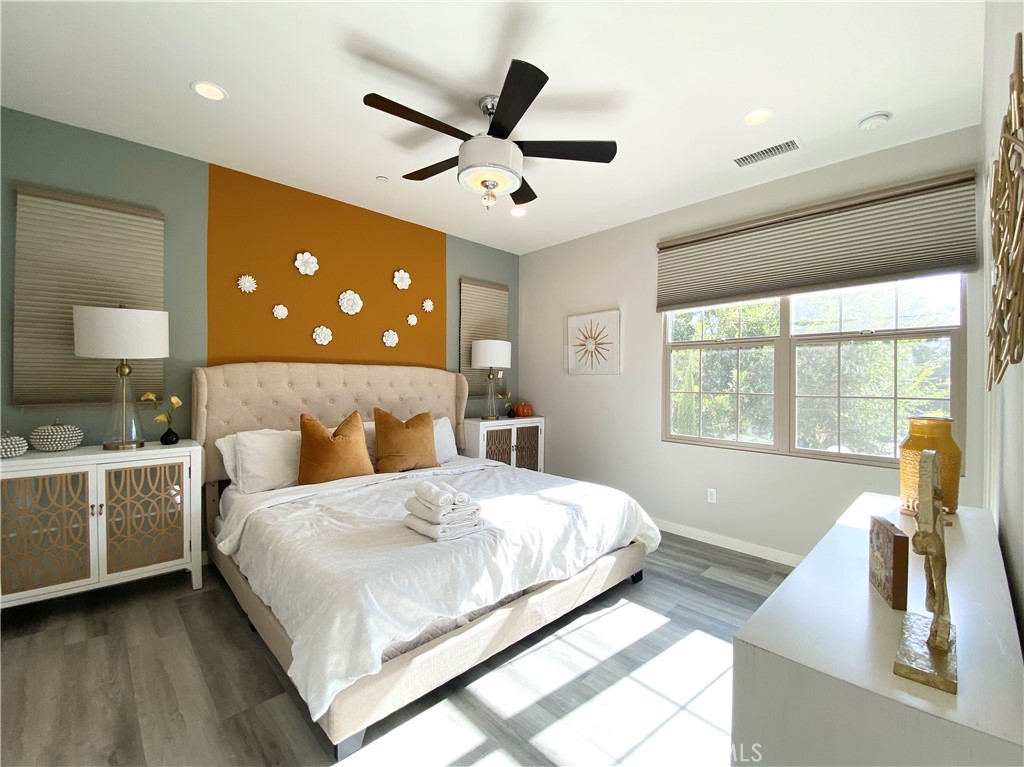 57 Bronze Leaf Irvine, CA 92620 - Photo 15 of 35 a bedroom with a large bed and a large window