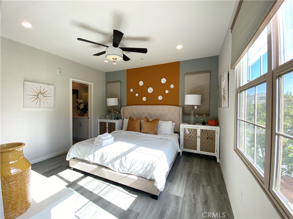 57 Bronze Leaf Irvine, CA 92620 - Photo 16 of 35 a bedroom with a large bed and a large window