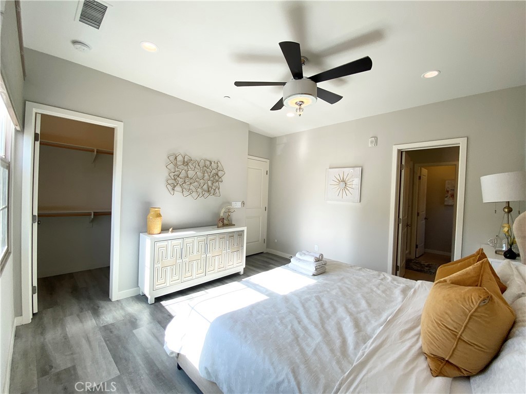 57 Bronze Leaf Irvine, CA 92620 - Photo 17 of 35 a bedroom with a bed and a painting on the wall