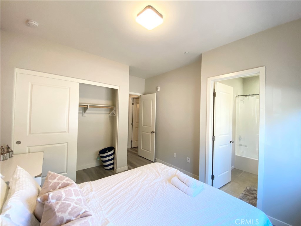 57 Bronze Leaf Irvine, CA 92620 - Photo 26 of 35 a bedroom with a bed and a bathroom