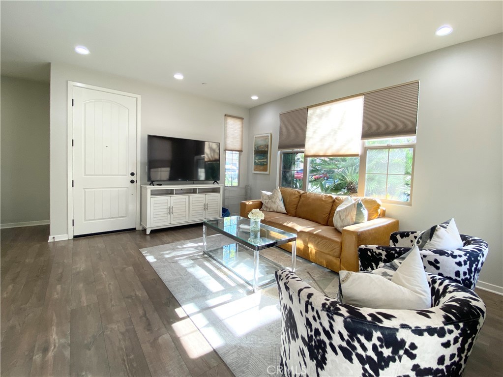 57 Bronze Leaf Irvine, CA 92620 - Photo 4 of 35 a living room with furniture and a flat screen tv