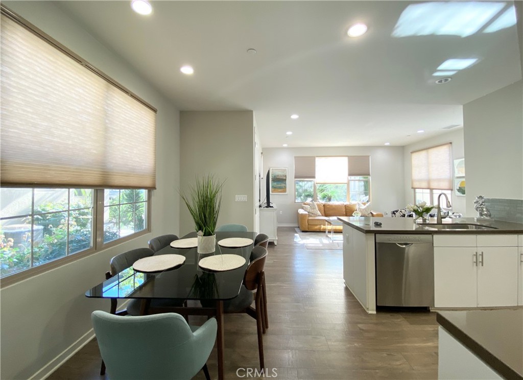 57 Bronze Leaf Irvine, CA 92620 - Photo 7 of 35 a kitchen with sink and view of living room
