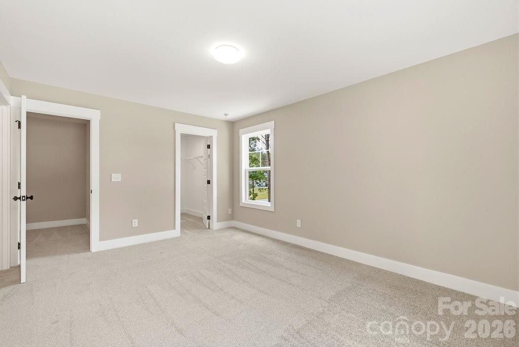1020 Baylor Grove Road, Unit 20 Monroe, NC 28112 - Photo 35 of 45 an empty room with windows and closet