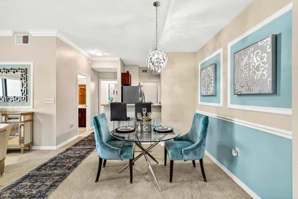 a dining room with furniture and window