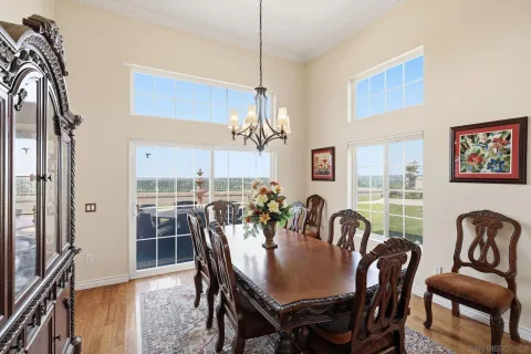 a view of a dining room with furniture window and outside view
