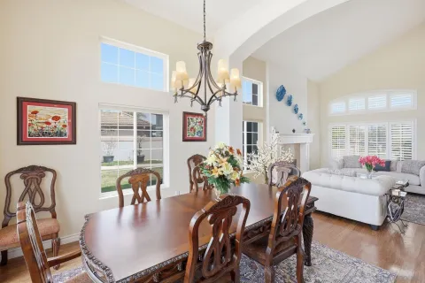 a living room with furniture fireplace and window