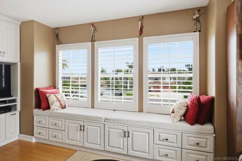 a bedroom with a bed and a book shelf