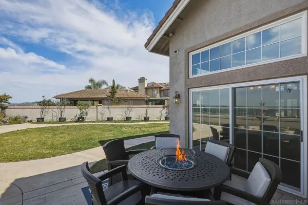 a view of a outdoor space with swimming pool and furniture