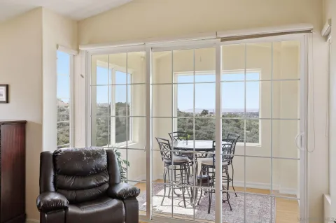 a view of a dining room with furniture window and outside view