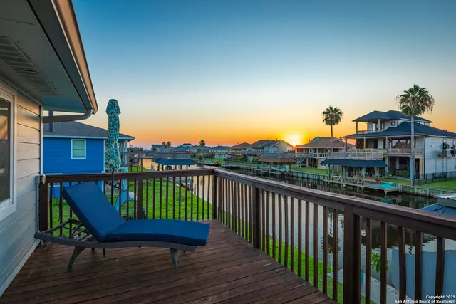 a view of a two chairs on the roof deck