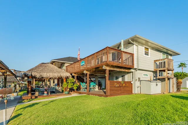 a view of a house with a yard porch and sitting area