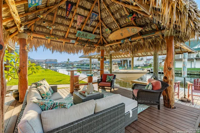 a front view of a house with outdoor seating