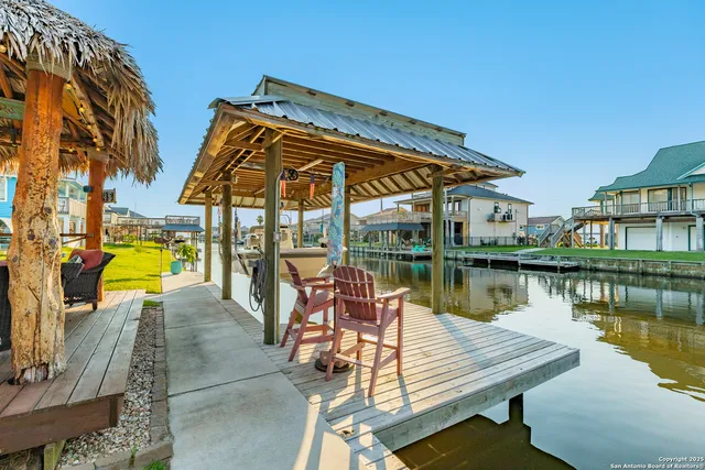 a view of a backyard with sitting area