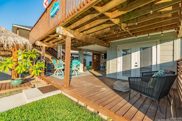 a patio with glass top table and sofas