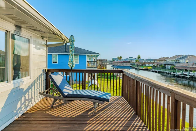 a view of outdoor space with deck and furniture