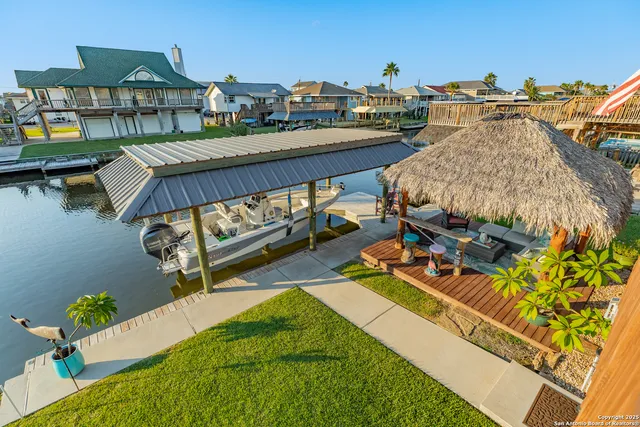 a front view of a house with sitting area