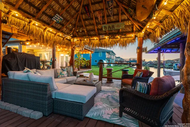 a outdoor living space with patio furniture and a fireplace